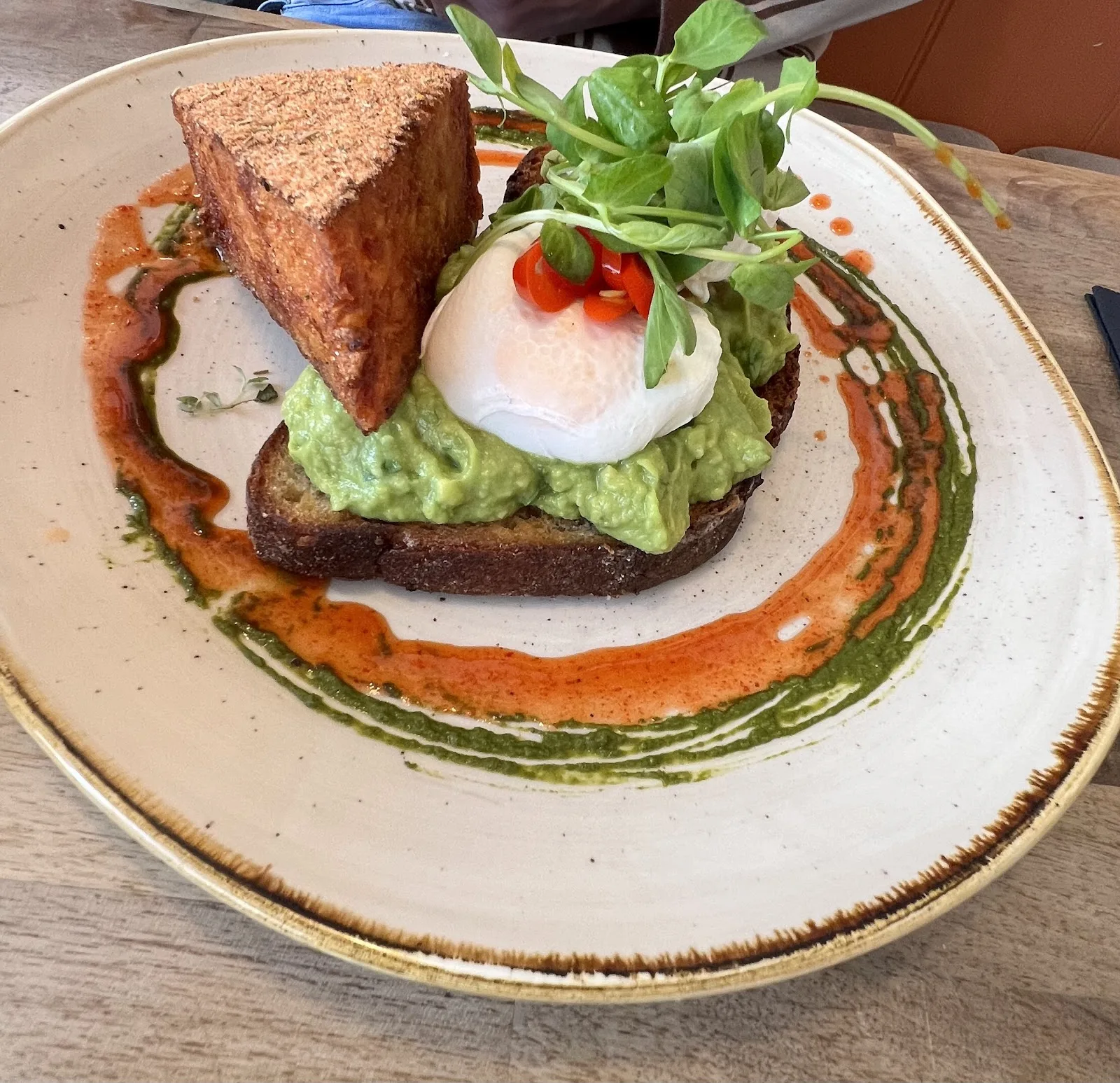 Smashed avocado on toast with a poached egg, chilli, pea shoots and a wedge of hashbrown at Ethos, Havant